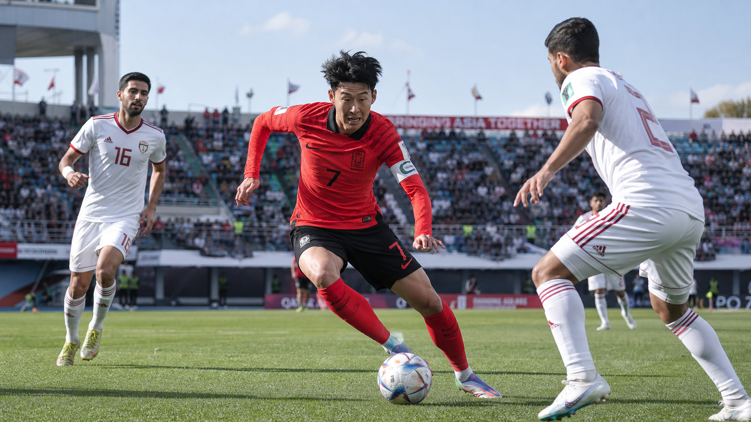한국 축구 선수가 필드에서 상대를 제치며 드리블하는 역동적인 장면