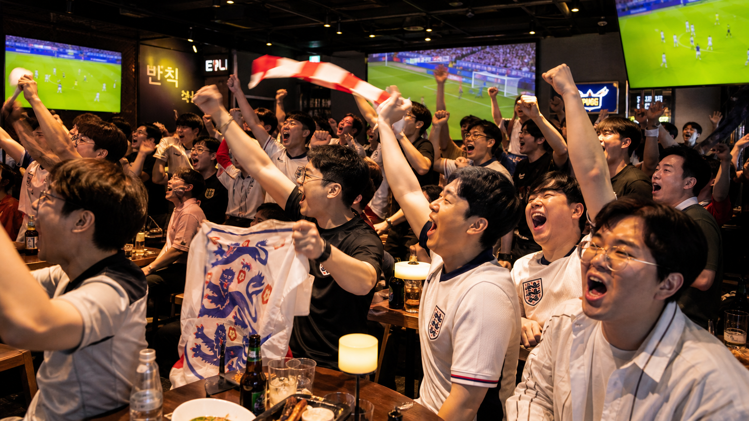 현대적인 스포츠 바에서 흥미진진하게 경기를 관람하는 열정적인 축구 팬들